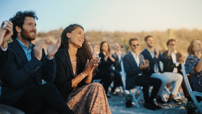 seated audience applauding